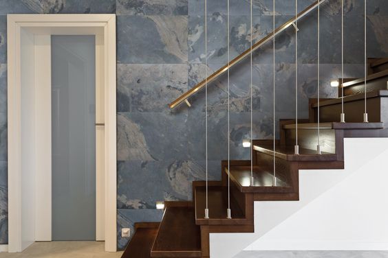 Wooden stairway and brick wall in luxury anteroom